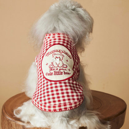 a red plaid sleeveless vest